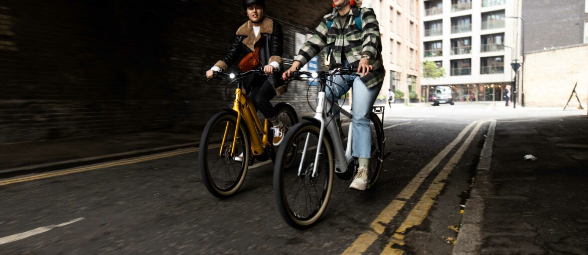 Photo of friends cycling together through London on Giant Bikes from Cadence Performance